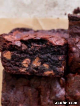 Artisan Brownie Bites 11 Close up of small batch fudgy brownies with one on it's side.