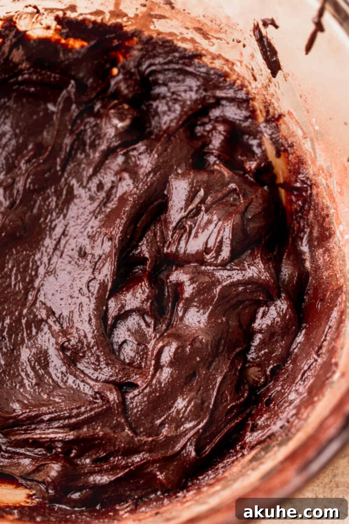 Artisan Brownie Bites 6 Smooth brownie batter in a glass bowl, ready for chocolate chips.