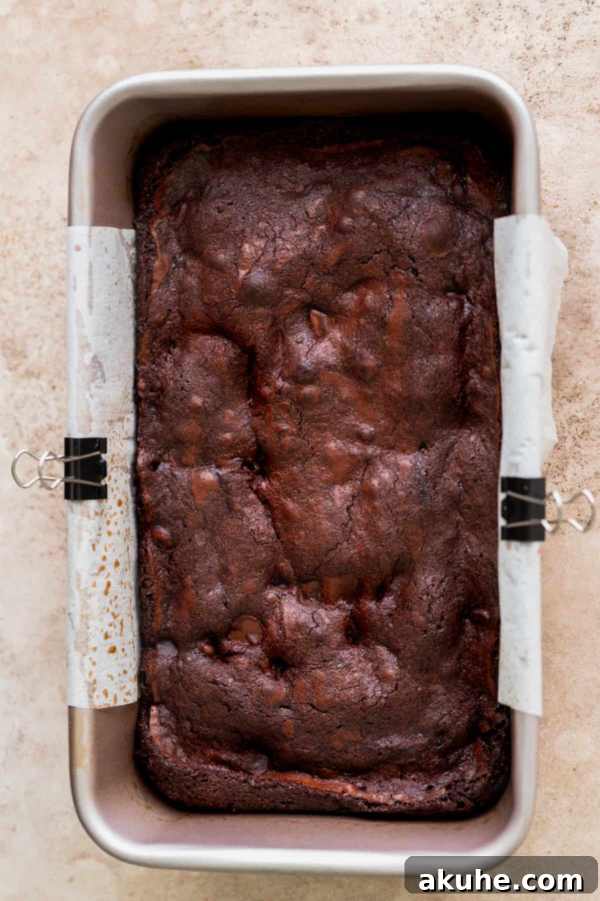 Artisan Brownie Bites 8 A perfectly baked brownie in a loaf pan, showing the golden-brown edges.
