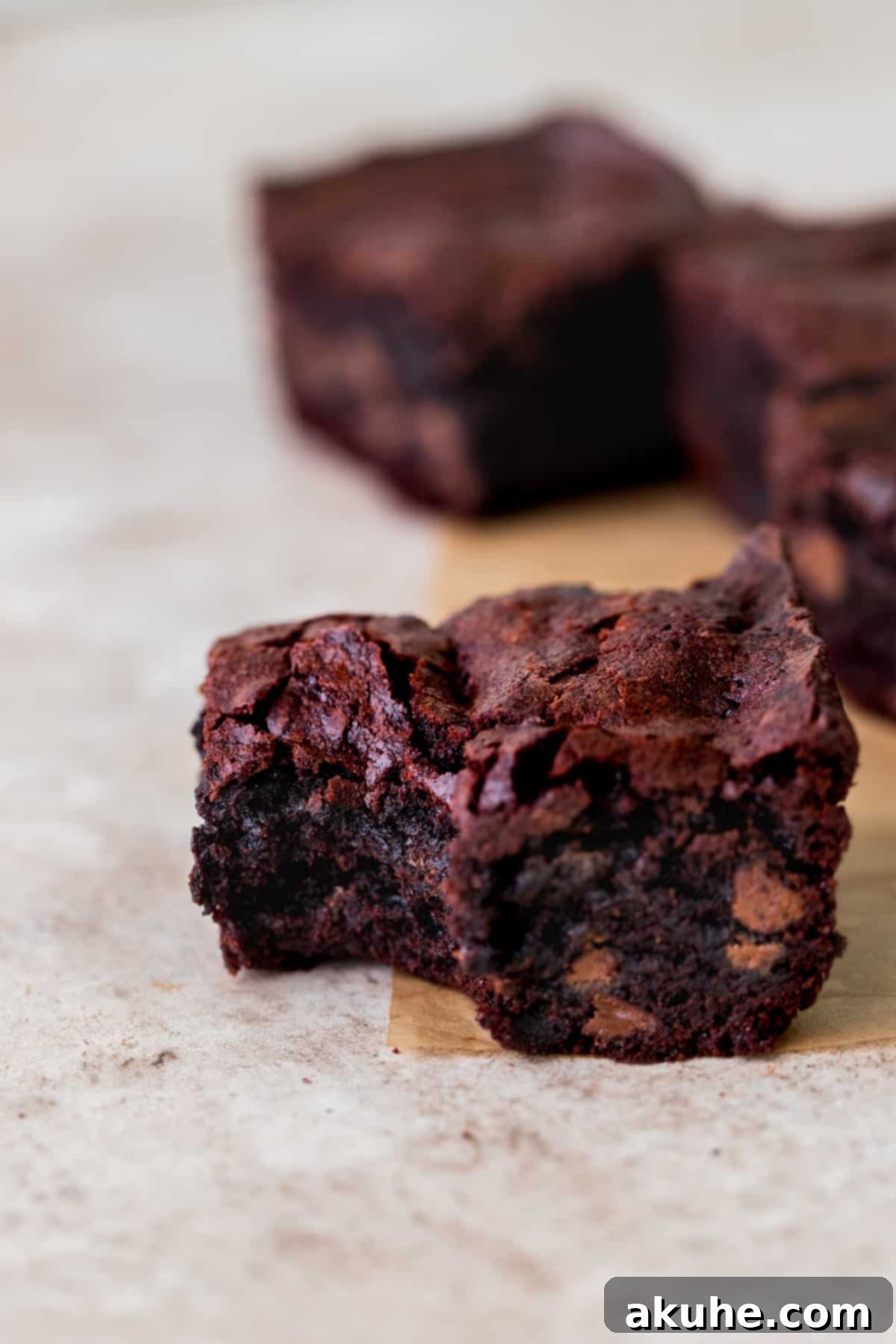 Artisan Brownie Bites 10 Bite missing from one brownie, showing the gooey interior.