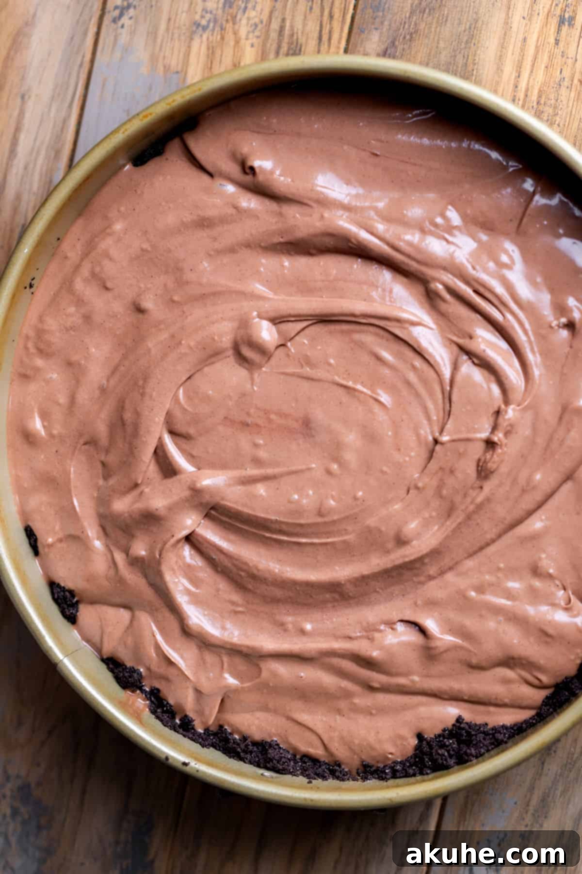 Decadent Nutella Cheesecake 6 Smooth Nutella cheesecake batter poured evenly into the Oreo crust in a springform pan.