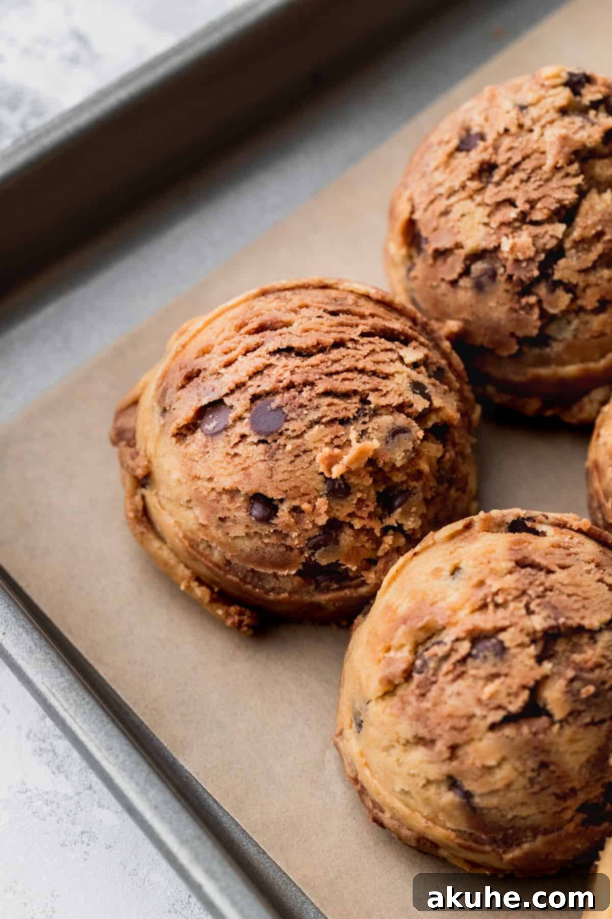 Decadent Peanut Butter Nutella Cookies 9 Close up of perfectly scooped, chilled cookie dough balls on a baking sheet, ready for the oven.