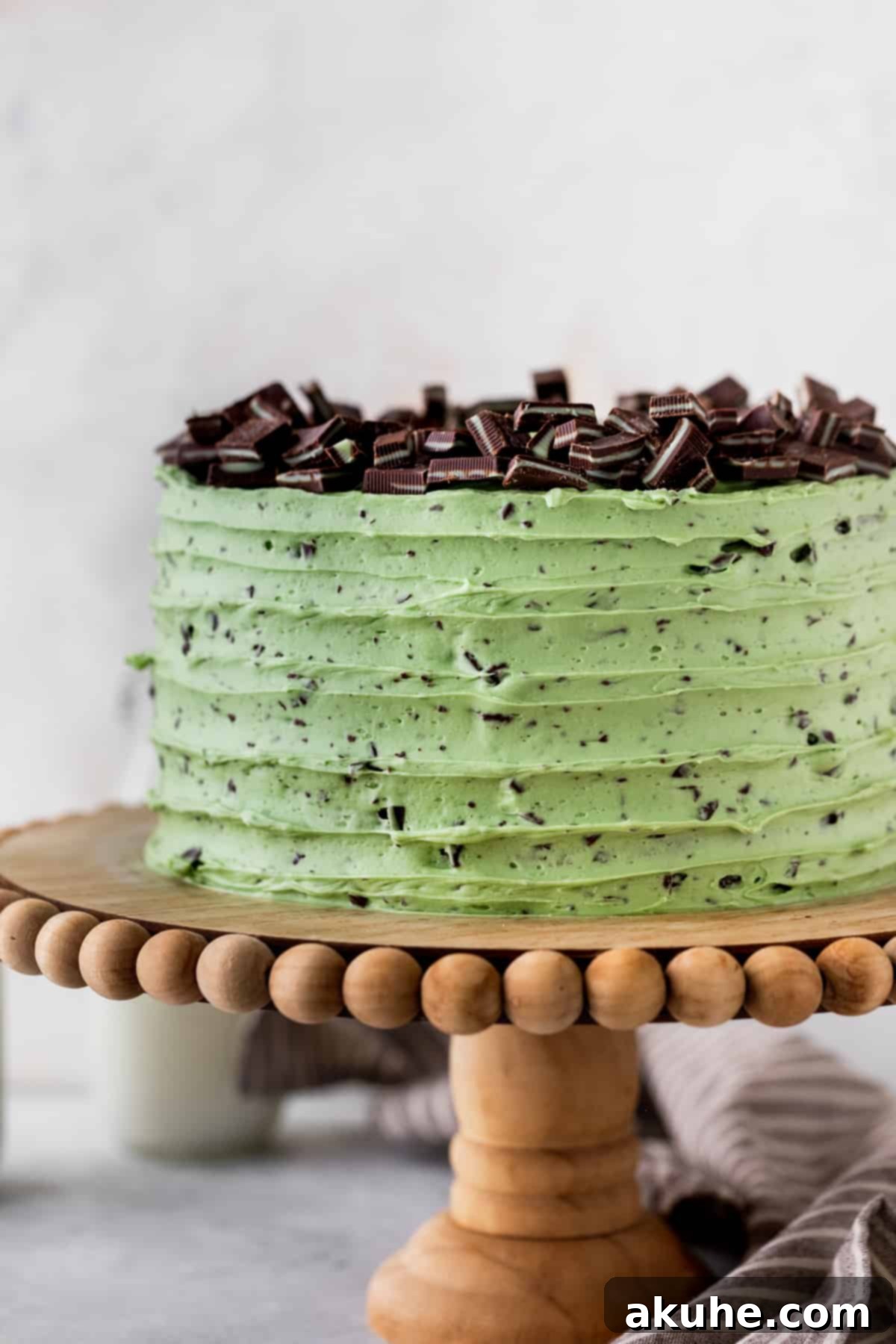 Andes Mint Chocolate Cake 11 Chocolate mint cake on a cake stand.