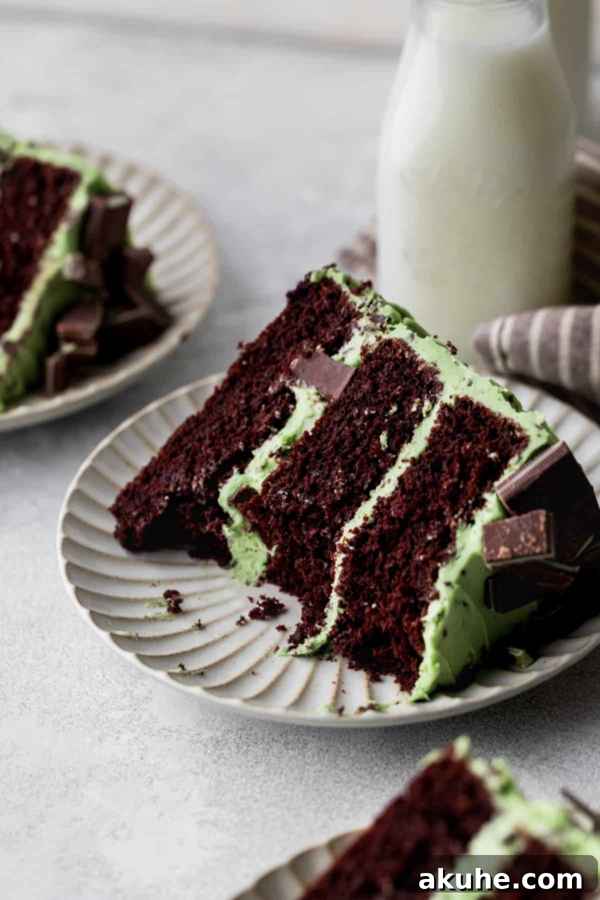 Andes Mint Chocolate Cake 3 Bites missing from slice of chocolate mint cake.