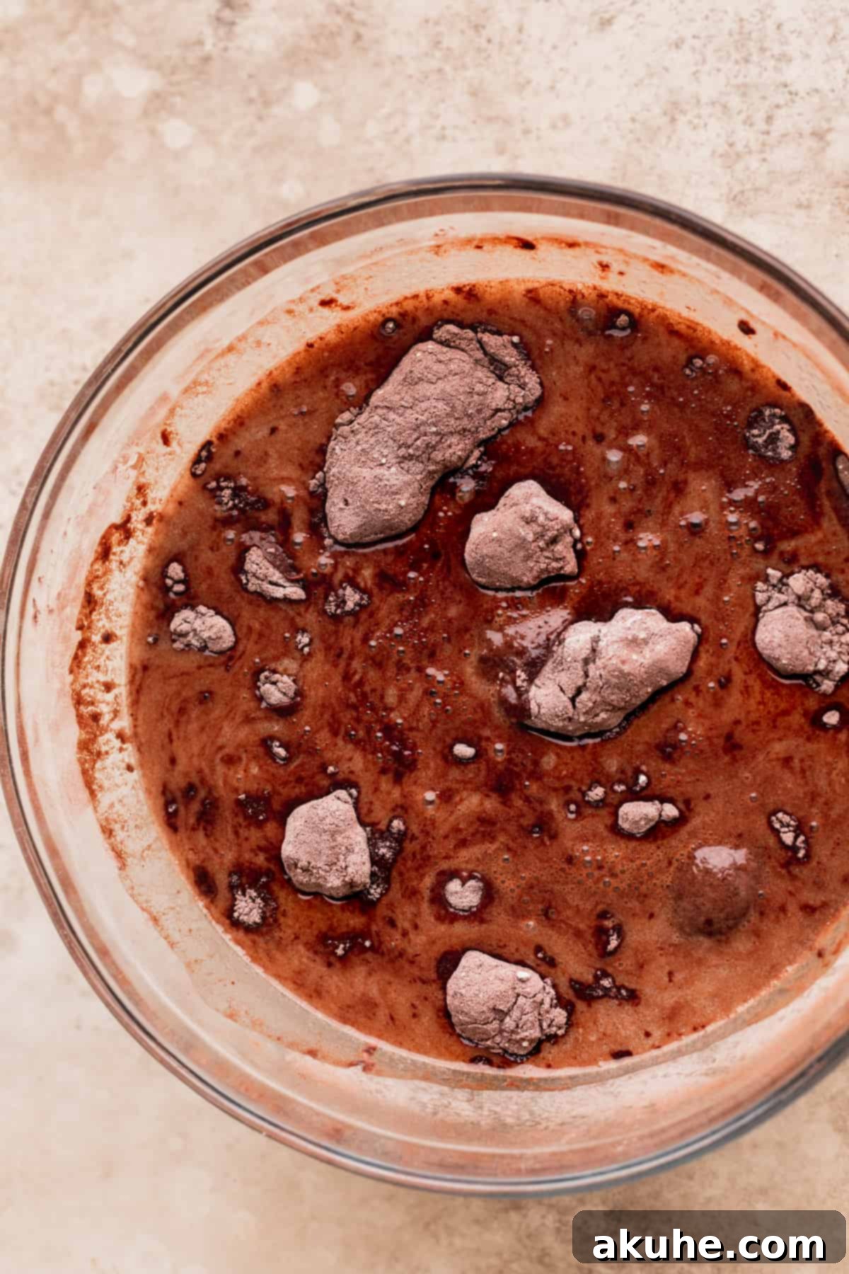 Andes Mint Chocolate Cake 4 Wet ingredients added to the dry ingredients in a glass bowl.