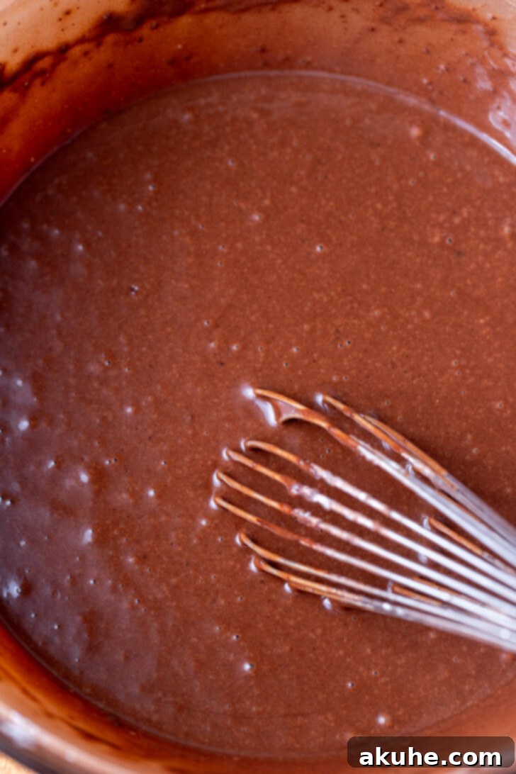 Oreo Dream Cheesecake 4 Chocolate cake batter in a mixing bowl.