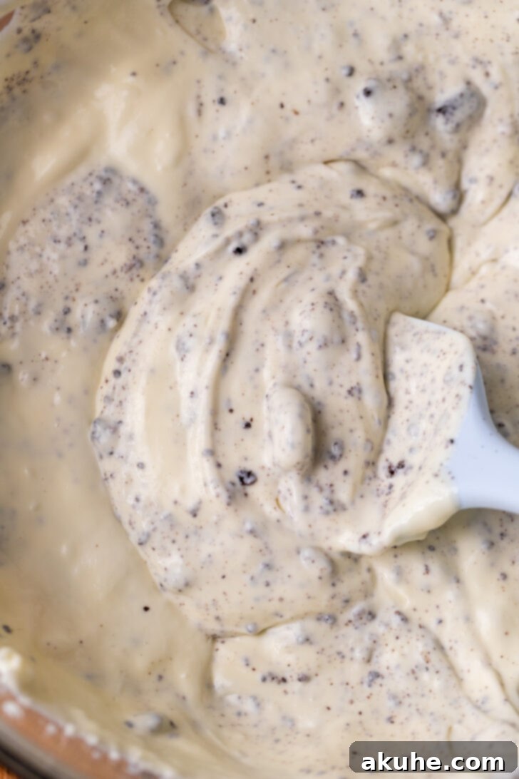 Oreo Dream Cheesecake 5 Oreo cheesecake batter in a mixing bowl.