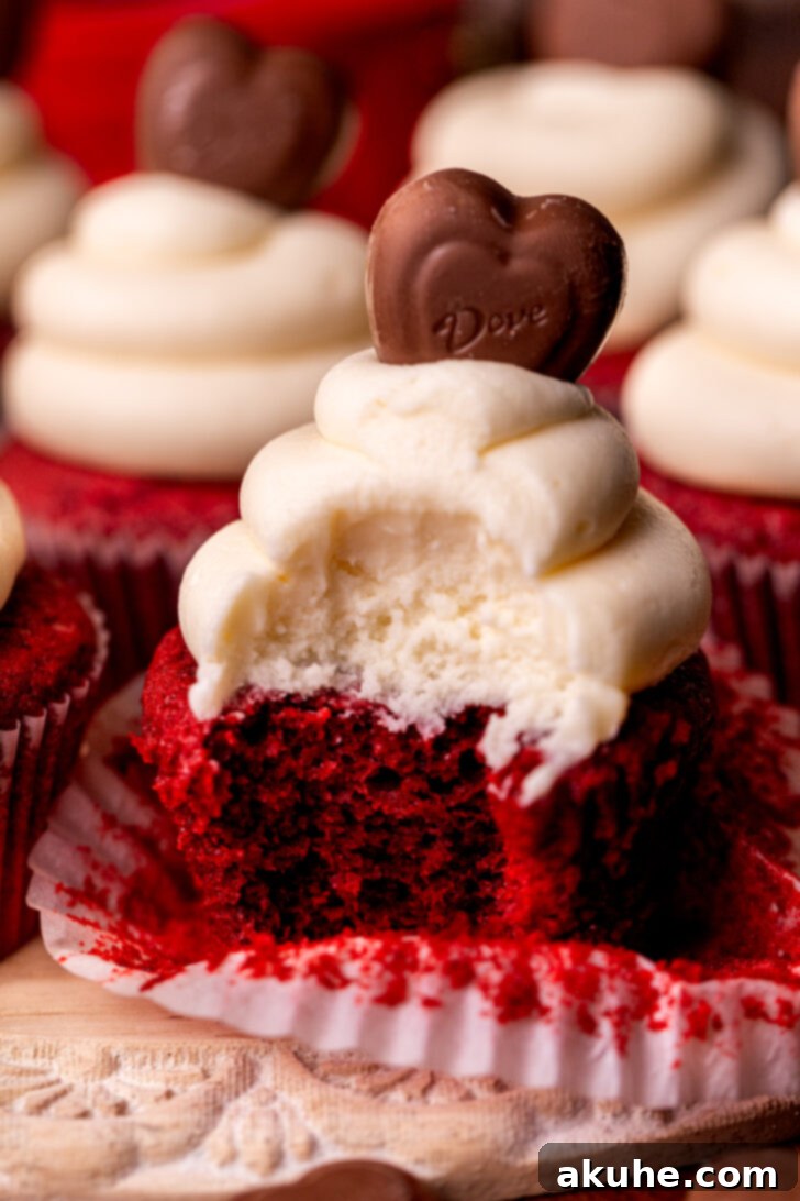 Red Velvet Delight 2 A delicious red velvet cupcake with a bite taken out, showcasing its moist crumb.