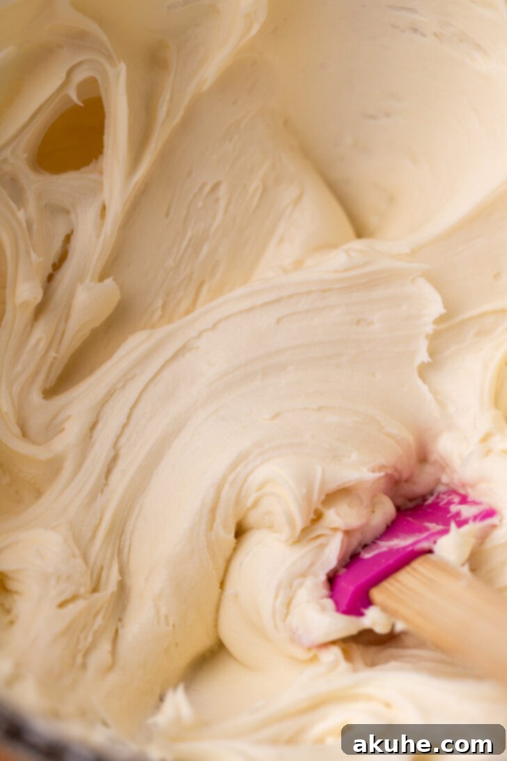 Red Velvet Delight 6 A bowl of fluffy and creamy cream cheese frosting.