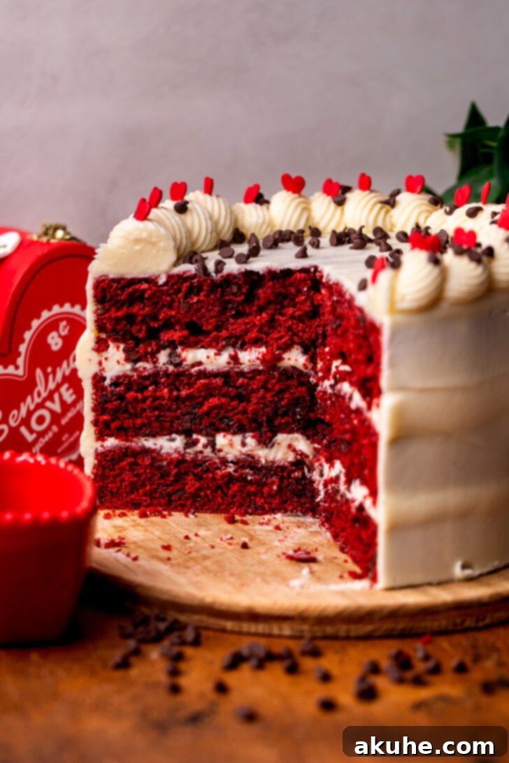 A stunning side view of the Red Velvet Chocolate Chip Cake showing its layers.