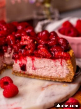 Taking a slice out of the raspberry cheesecake.